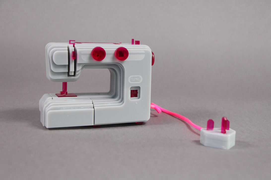 photograph of Cosplay Toolkit sewing machine laser cut from perspex