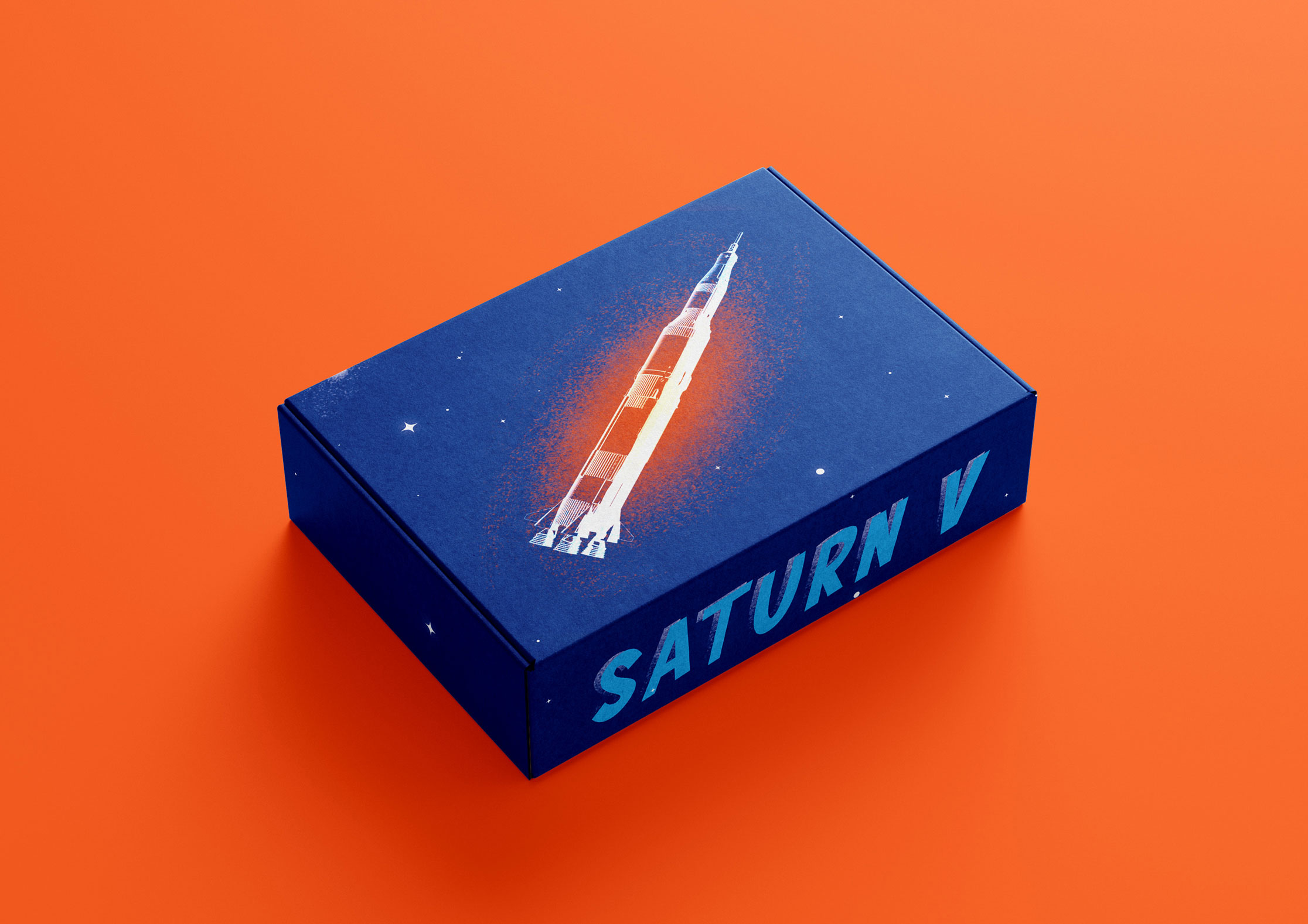 Mock-up of product packaging box with Saturn V typography and an illustration of a space rocket